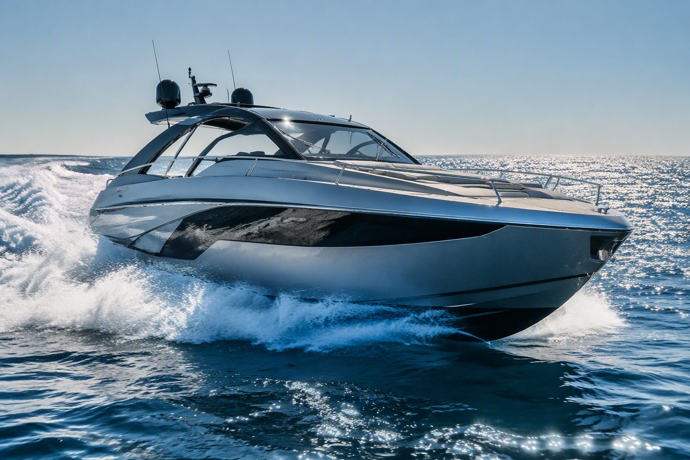 Silver Arrow — sleek sporty open luxury yacht carving through waves